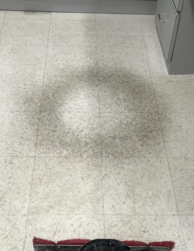 Damaged and stained tile floor in Mokena, Illinois